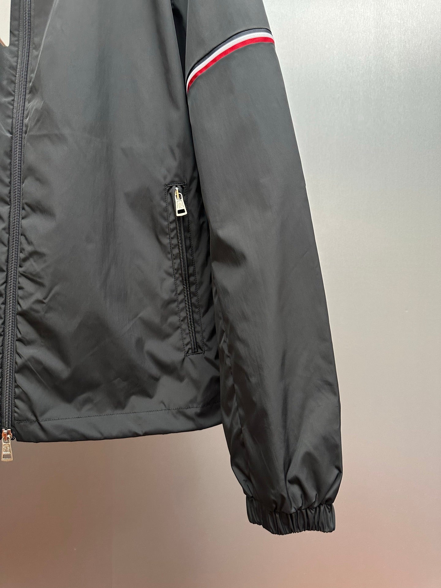Moncler long jacket sleeve detail with front zipper and ribbed elastic cuff