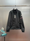 Moncler long jacket with front zipper, stand collar, and sleeve logo patch