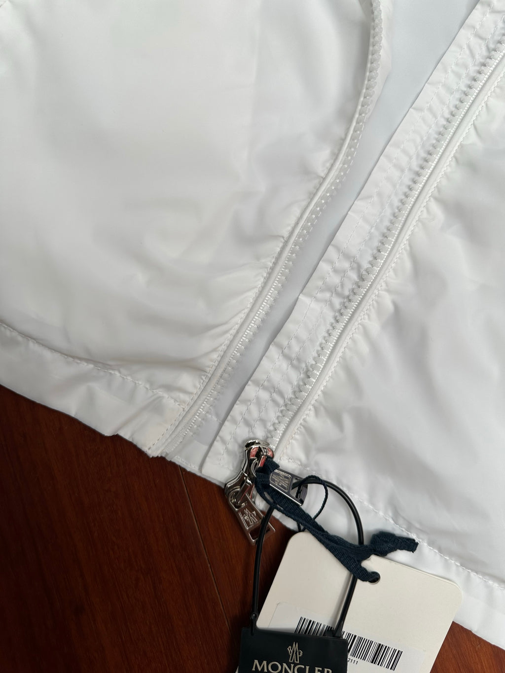Moncler long white jacket back with zipper, belt cord, and size tag