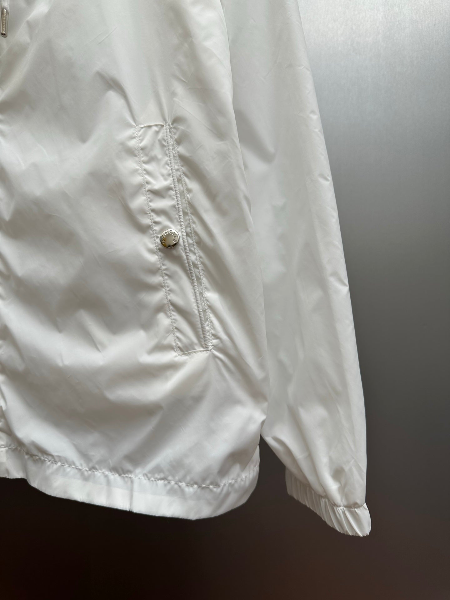 Moncler long white jacket sleeve with buttoned chest pocket detail