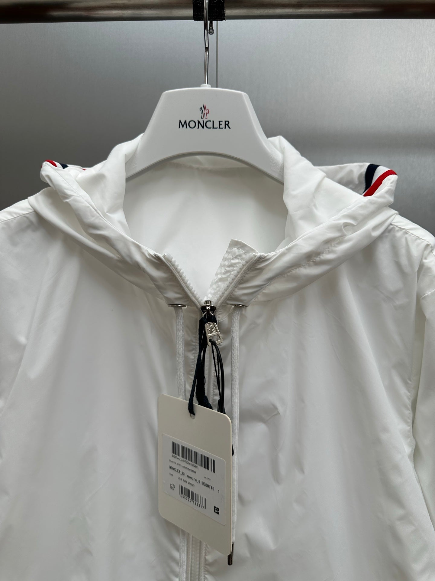 Moncler hooded long jacket with front zipper and drawstring collar