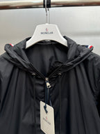 Moncler long black hooded jacket with full zipper and visible hood draw cords