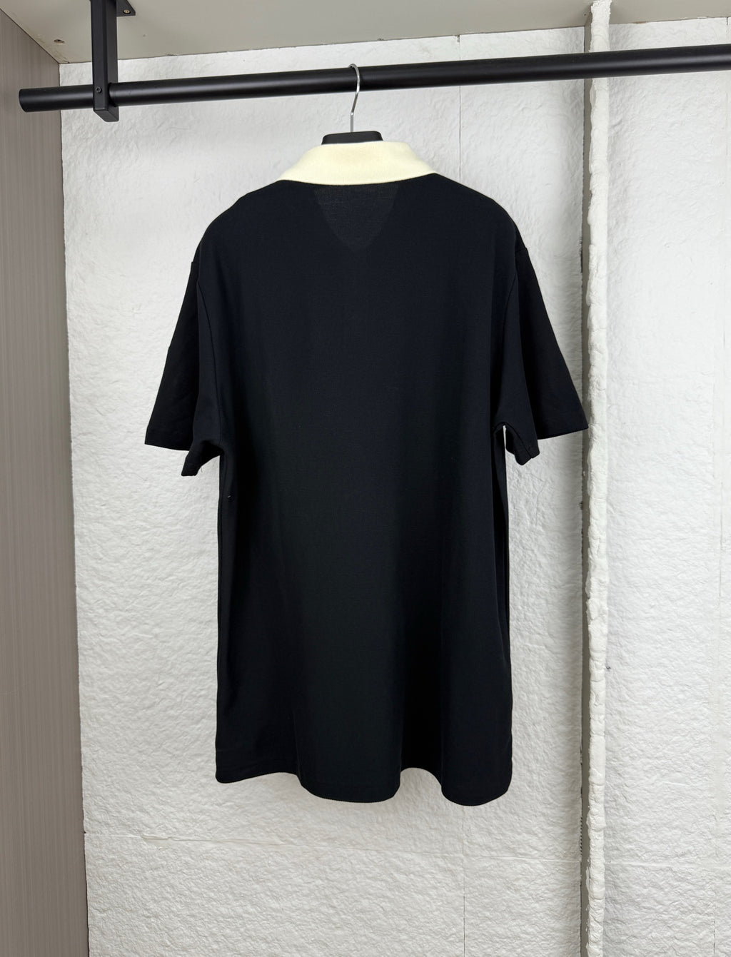 Moncler polo shirt back view, black short sleeves and crew neckline