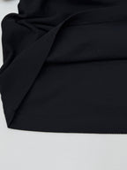 Moncler polo shirt fabric close-up with textured black knit