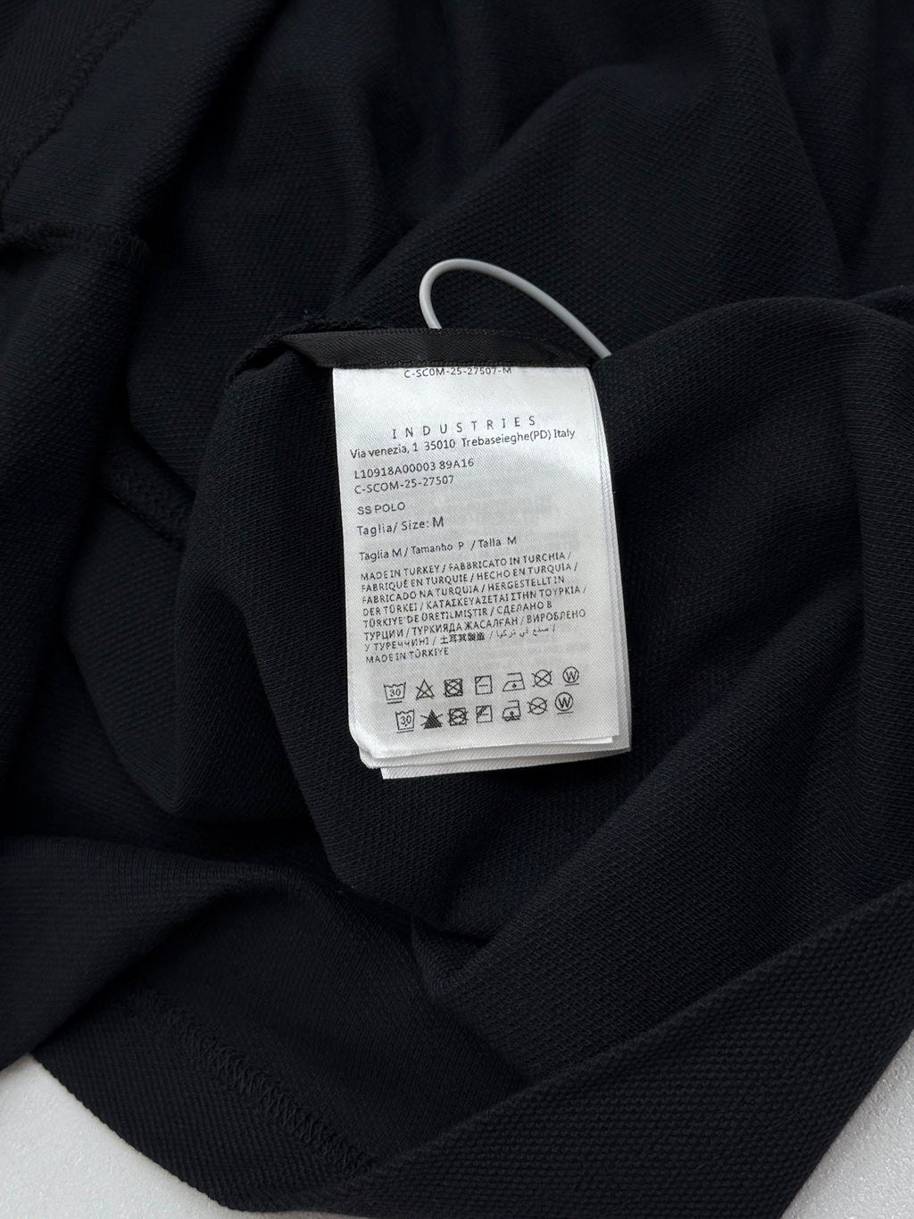 Moncler polo shirt interior neck label with care and size text