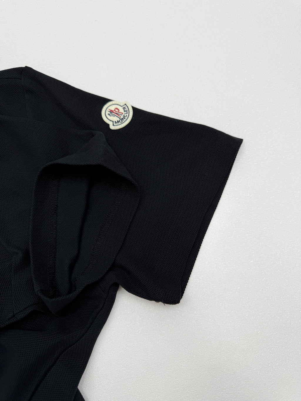 Moncler polo shirt shoulder and sleeve detail with crest patch