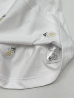 White T-shirt neckline and hem details with care label inside