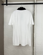 Moncler short-sleeve polo shirt back view, white with black trim on collar