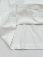 Moncler white polo shirt cuff and folded hem detail