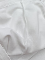 Moncler white polo shirt fabric texture close-up