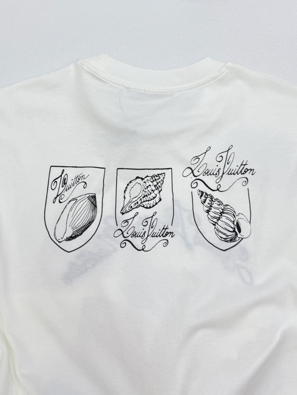 White Louis Vuitton T-shirt with three shell shield prints and signature