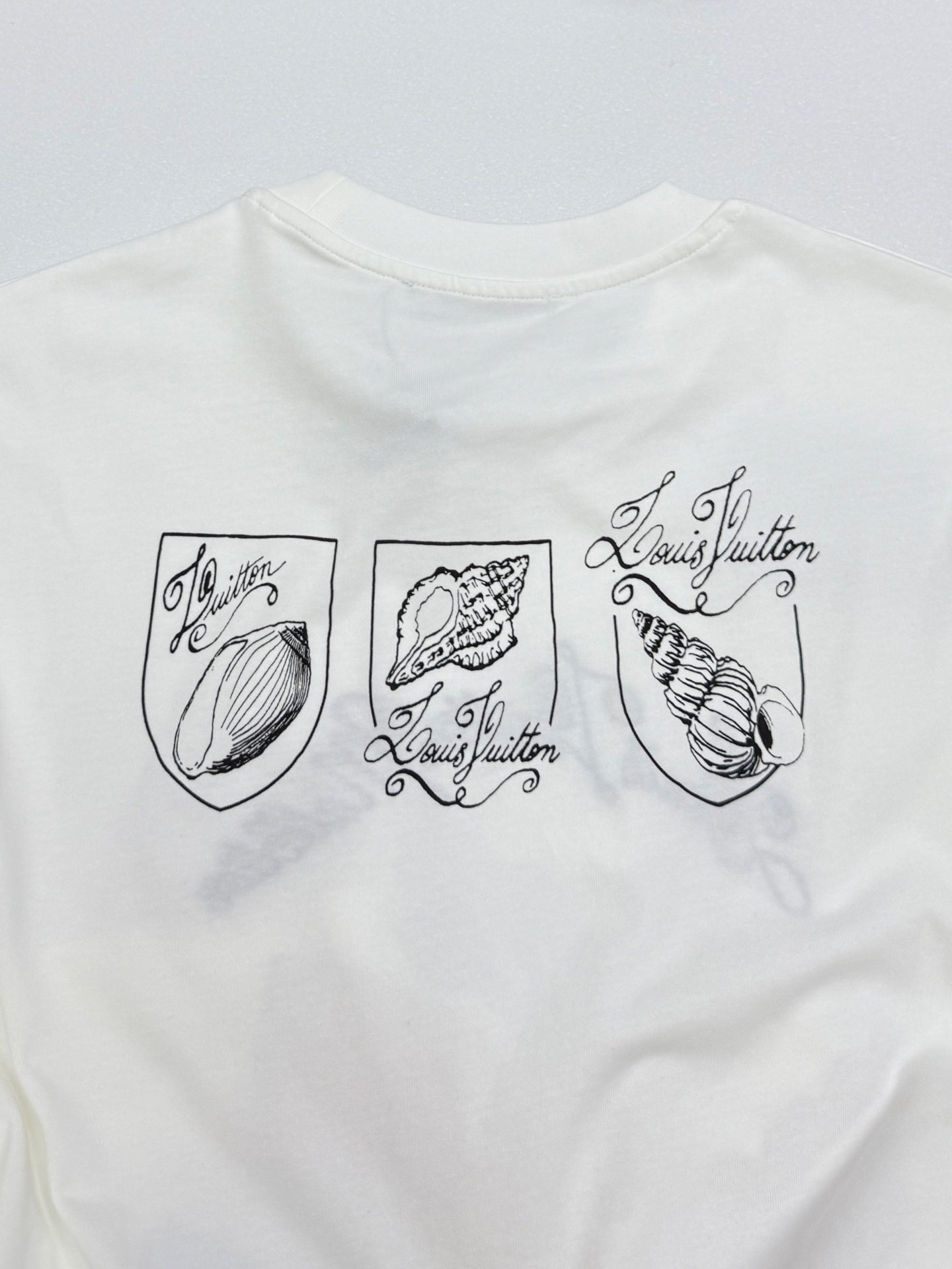 White Louis Vuitton T-shirt with three shell shield prints and signature