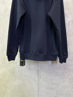 Navy hoodie back view with cuffs, kangaroo pocket, and size tag