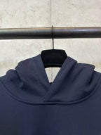 Navy hoodie hood with soft drape and ribbed neckline