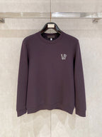 Purple crewneck sweatshirt with small V logo on left chest