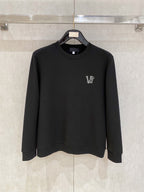Black crewneck sweatshirt with small V logo on left chest