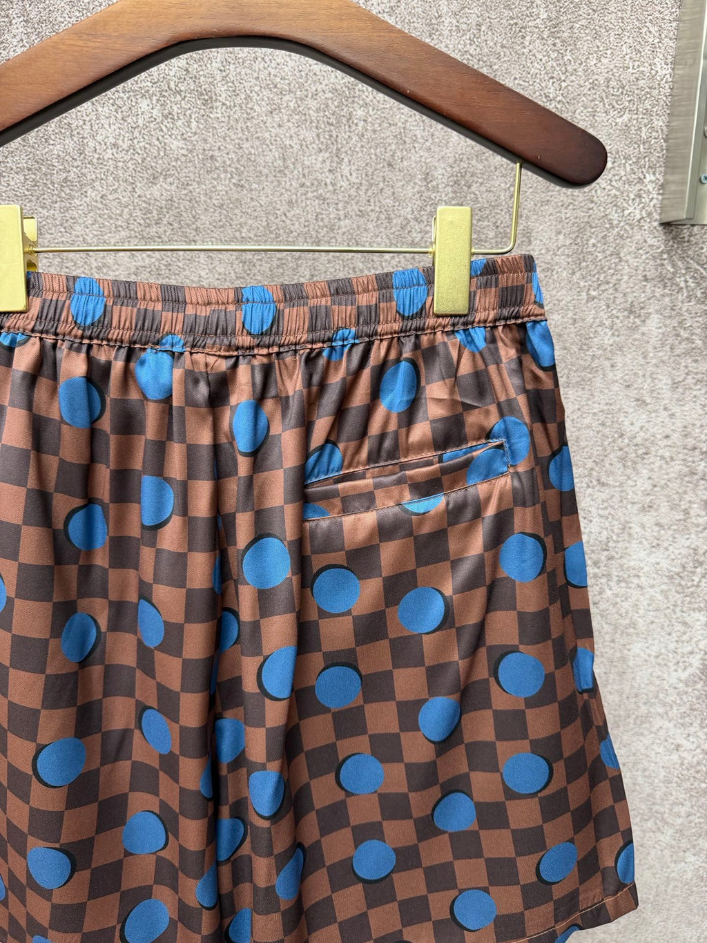 Louis Vuitton check shorts with blue dots, drawstring tie and pocket detail