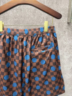 Louis Vuitton check shorts with blue dots, drawstring tie and pocket detail