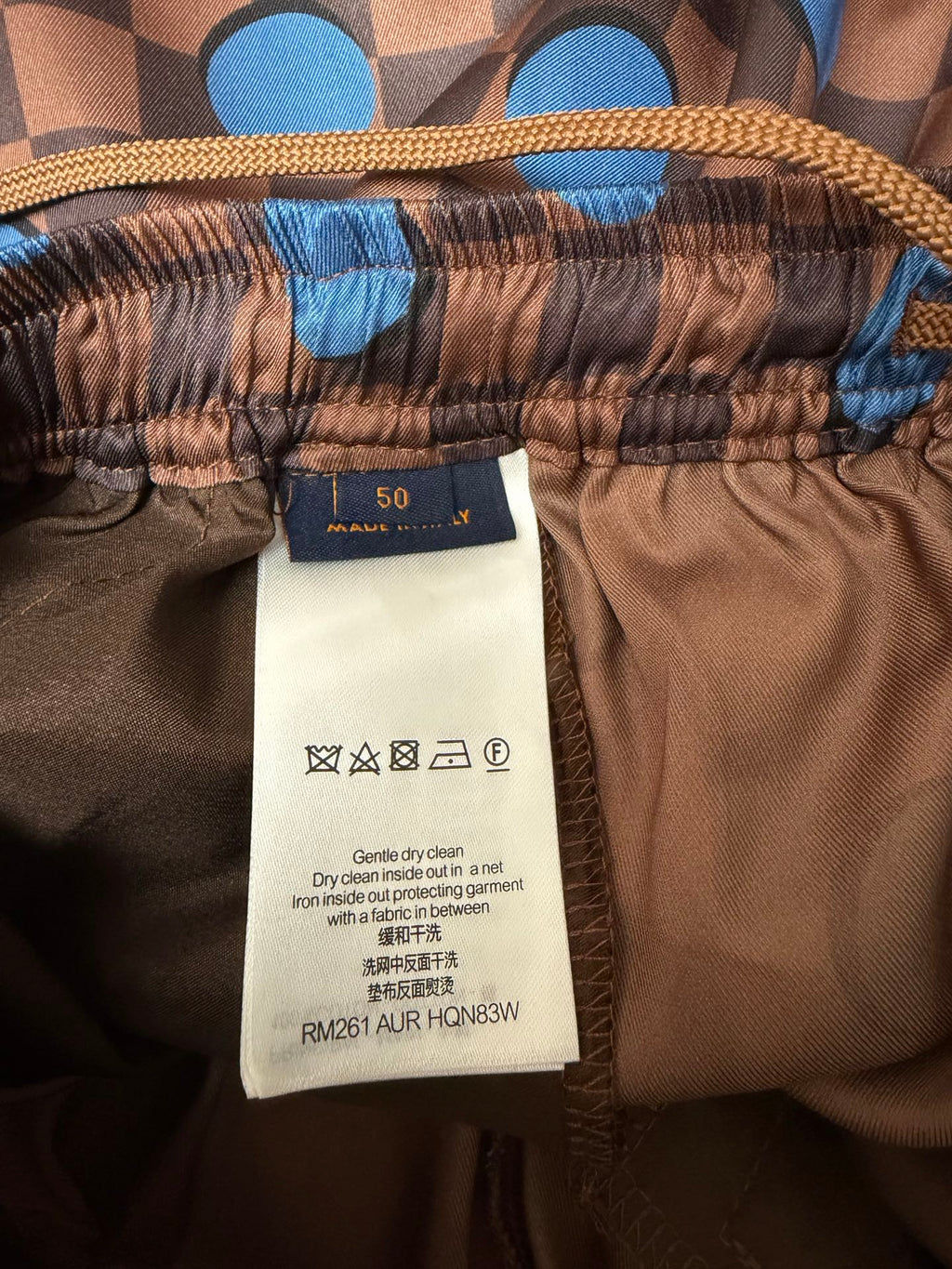 Louis Vuitton shorts fabric care label and size tag at waistband