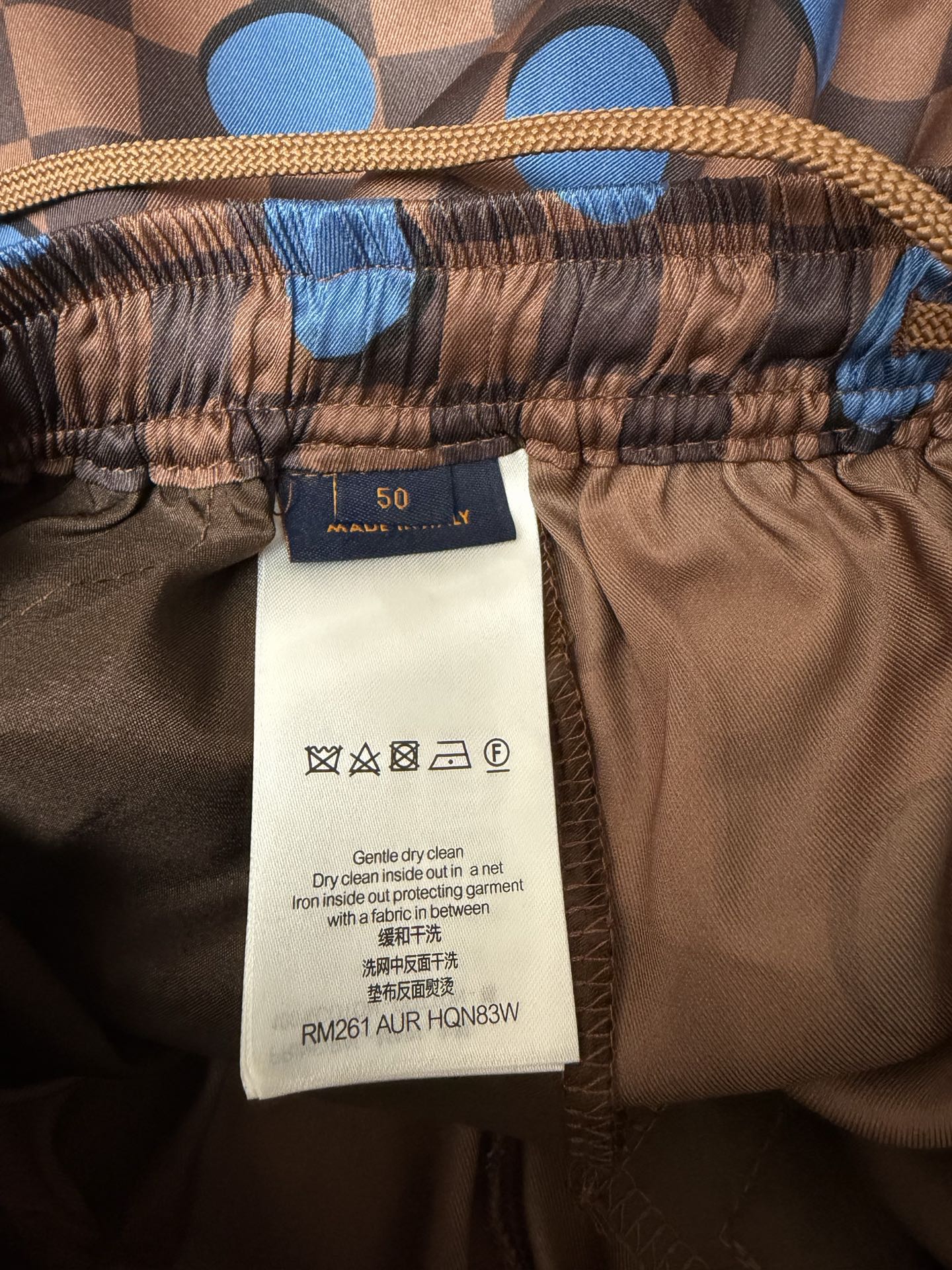 Louis Vuitton shorts fabric care label and size tag at waistband