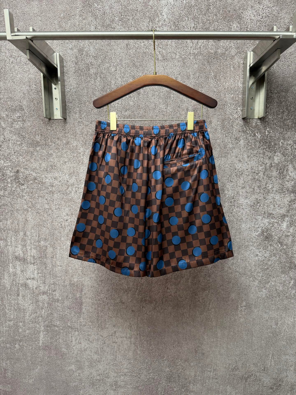 Louis Vuitton check shorts with blue dot print, front view, elastic waist