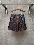 Louis Vuitton check shorts with blue dot print, front view, elastic waist