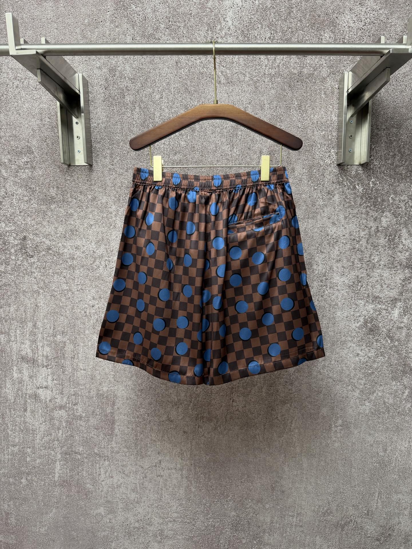 Louis Vuitton check shorts with blue dot print, front view, elastic waist