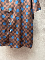 Brown short-sleeve shirt front panel with blue circle dots and round button details