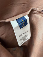 Brown fabric garment tag with size L and Made in Italy label