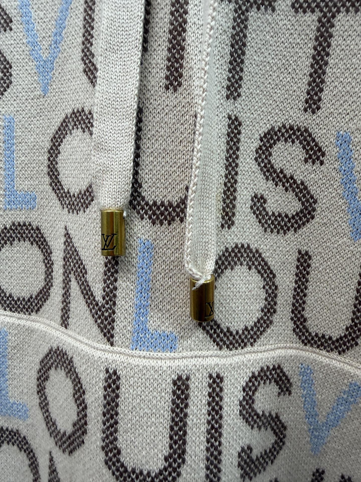 Louis Vuitton monogram hoodie detail, gold-tone pull tab on front drawcord