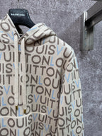 Louis Vuitton monogram zip-up hoodie sleeve detail, cream knit with blue accents