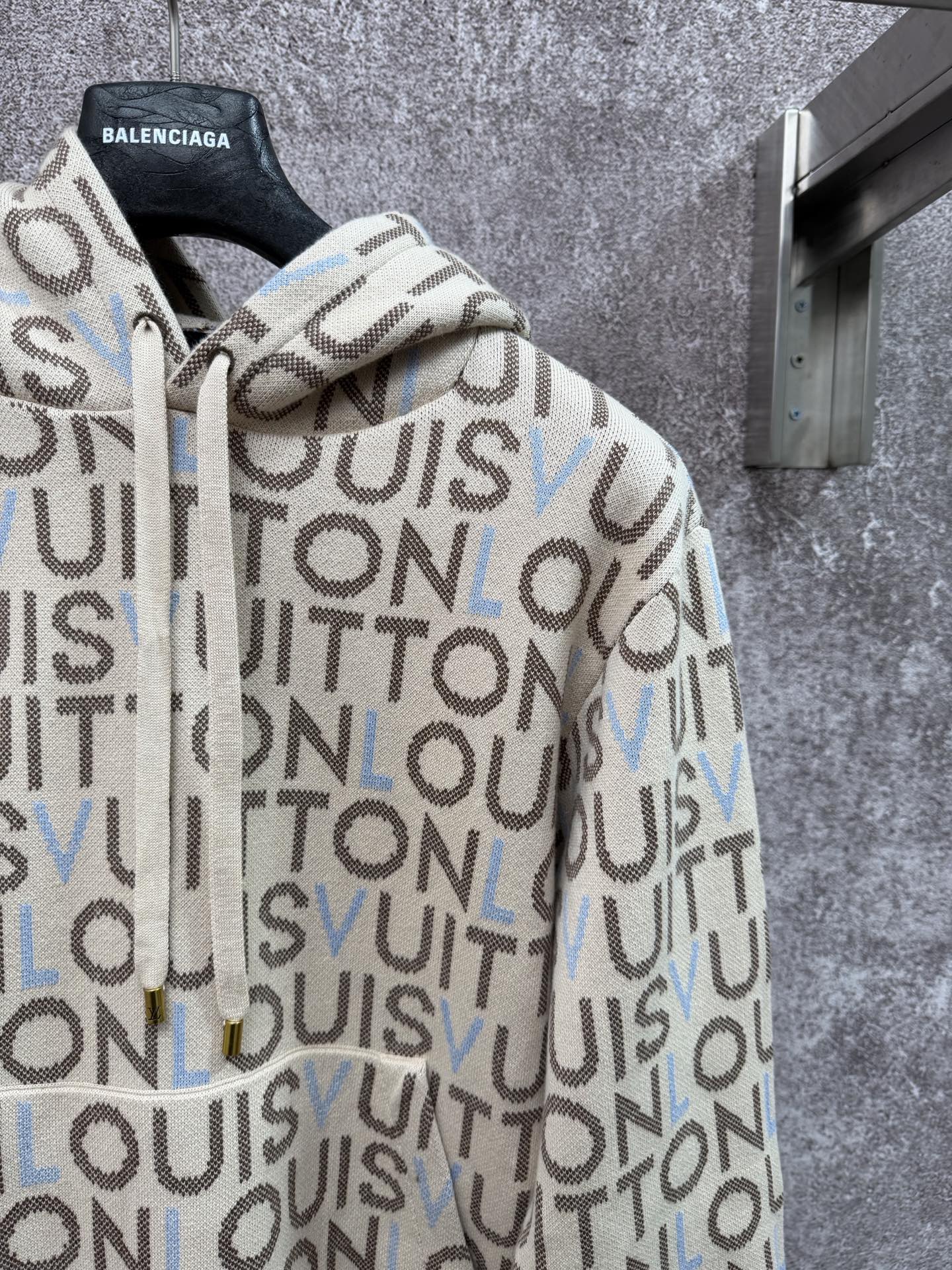 Louis Vuitton monogram zip-up hoodie sleeve detail, cream knit with blue accents