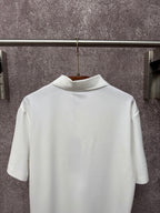 White Dior polo shirt back view on hanger with short sleeves and ribbed collar