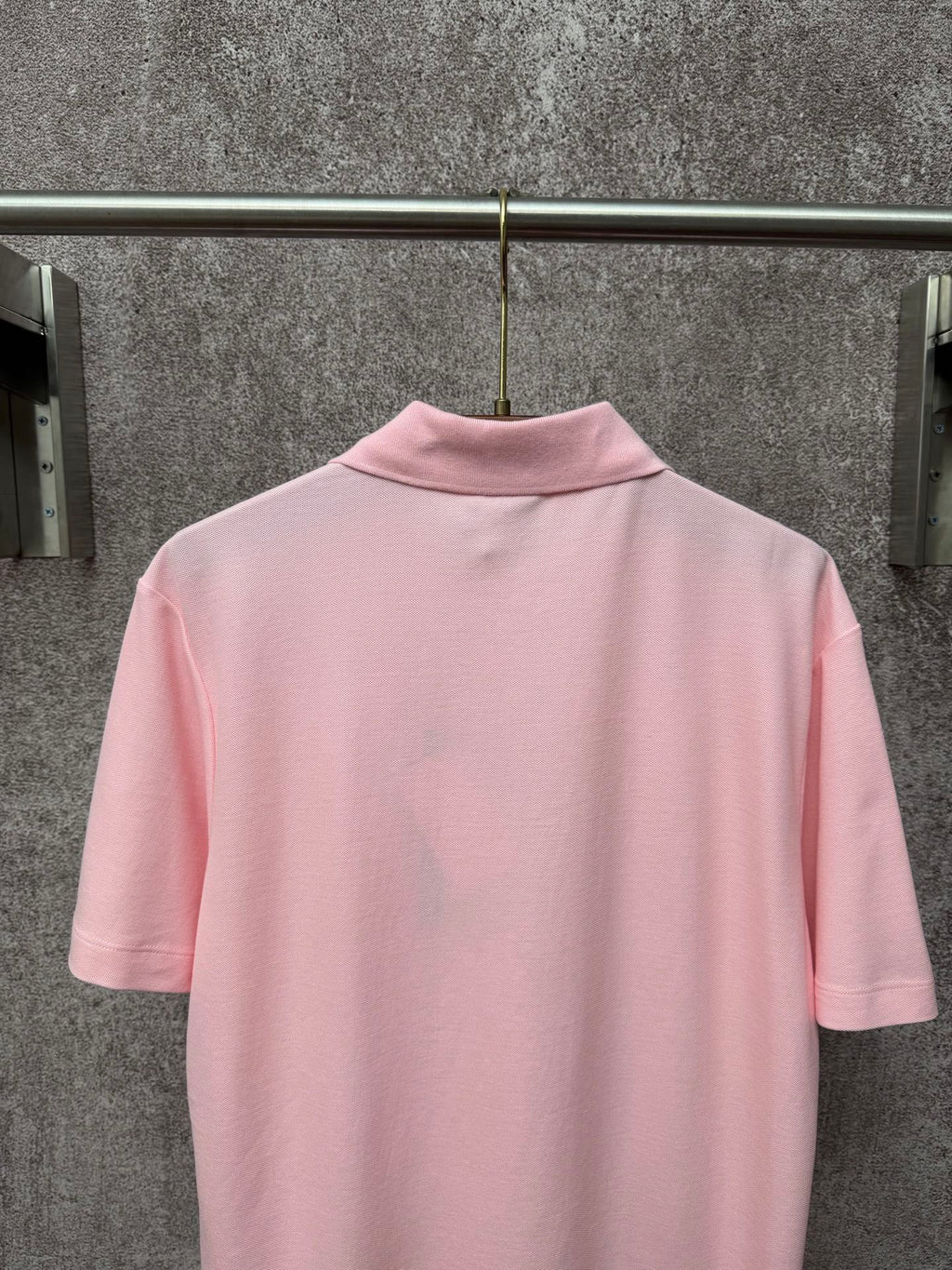 Dior polo shirt in light pink, back view with ribbed collar and short sleeves