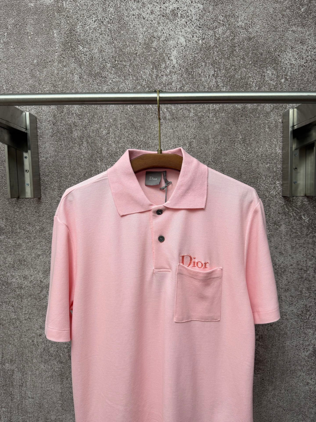 Dior short-sleeve polo shirt in light pink, front view with embroidered chest logo