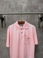 Dior short-sleeve polo shirt in light pink, front view with embroidered chest logo