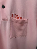 Dior polo shirt pocket detail in light pink, with embroidered logo on chest pocket