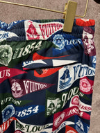 Logo-printed shorts with elastic waistband and drawstring ties