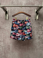 Patterned shorts with elastic waistband and drawstring, multicolor logo print