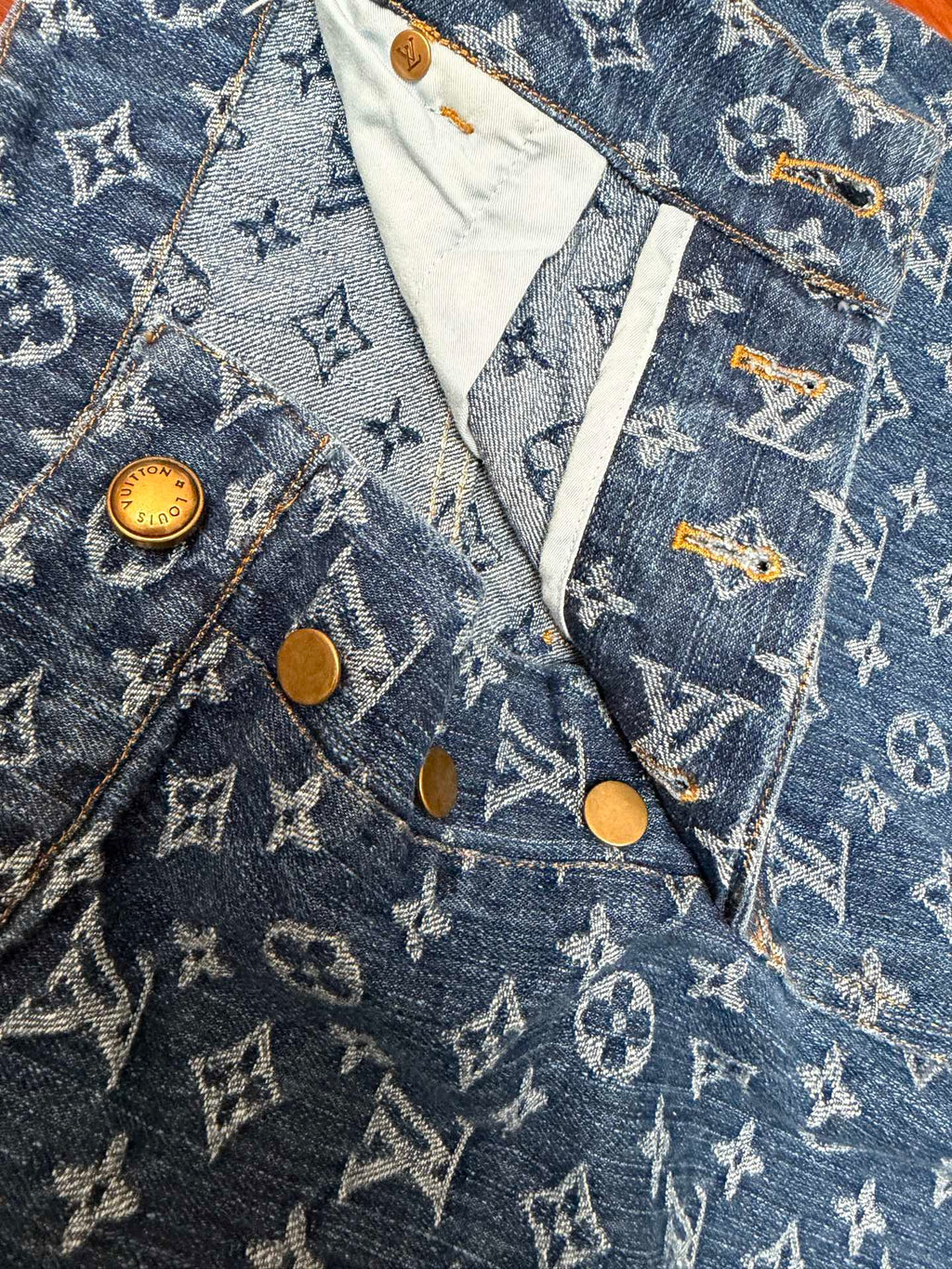 Louis Vuitton monogram denim shorts front with flap pocket and gold buttons
