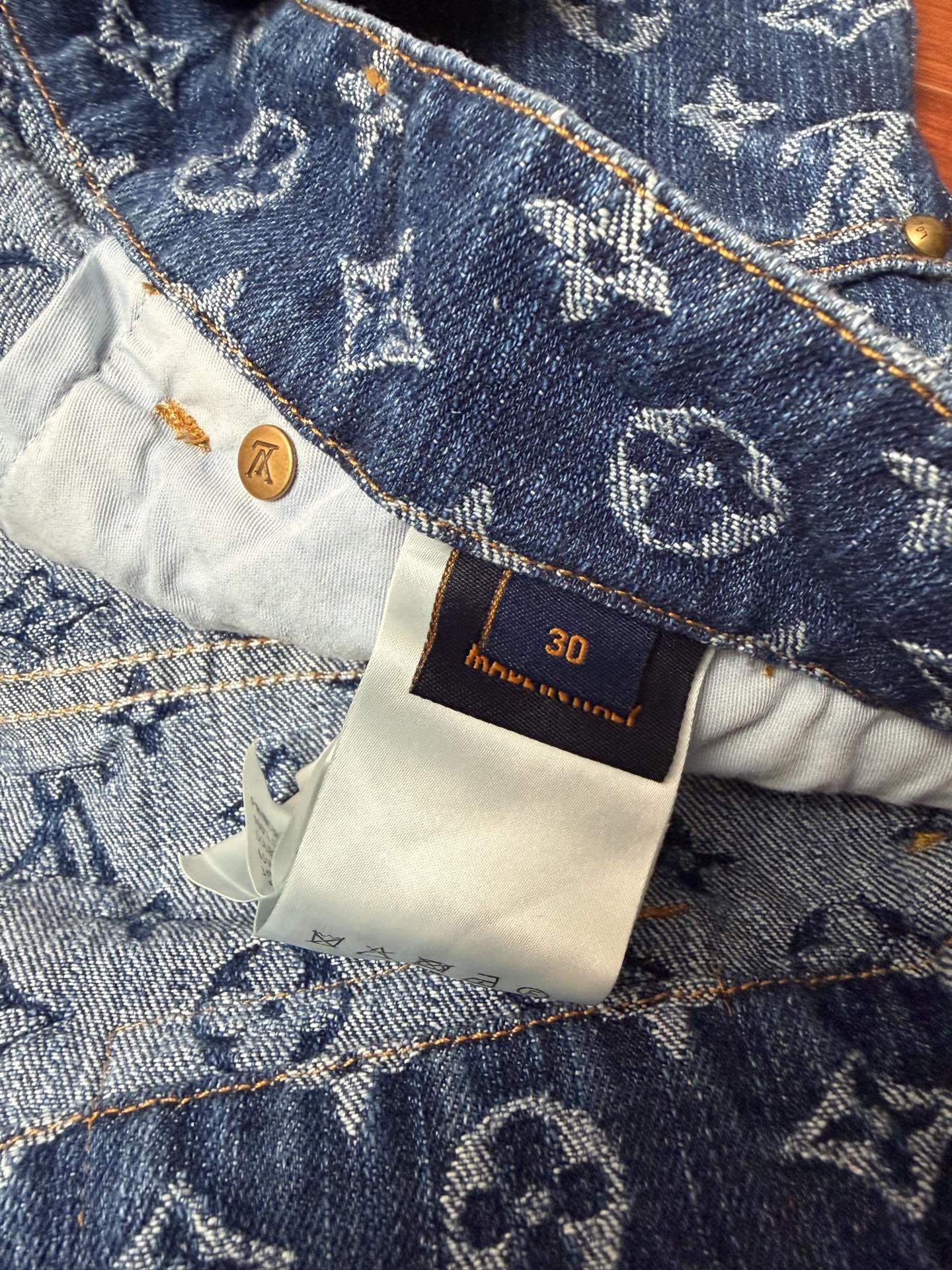 Louis Vuitton denim shorts size 30 care label on waistband