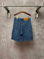 Louis Vuitton monogram denim shorts, front view with button closure