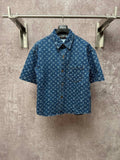 Blue patterned short-sleeve button-up shirt with spread collar and front buttons