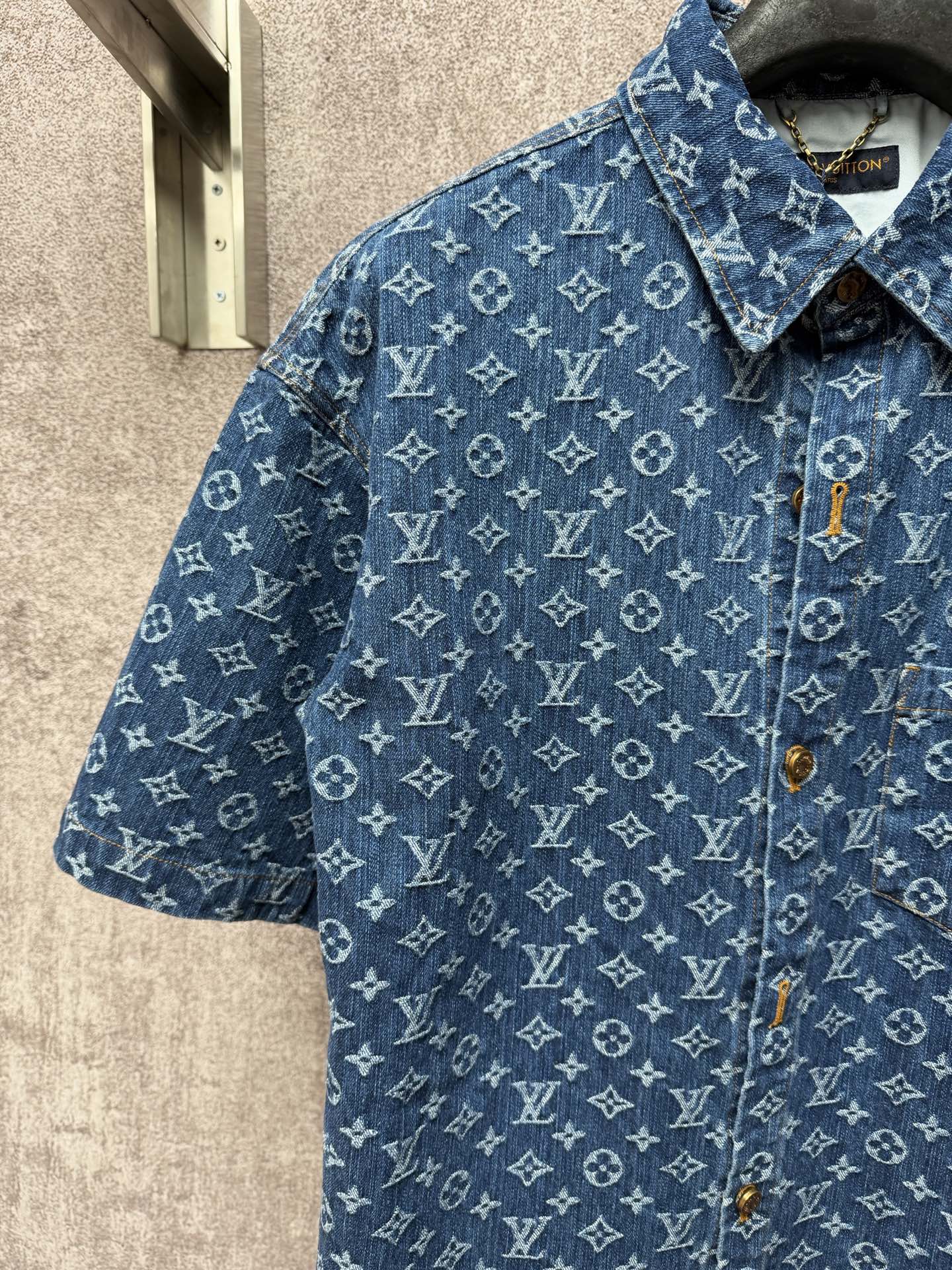 Blue monogram short-sleeve shirt with pointed collar and gold-tone button details