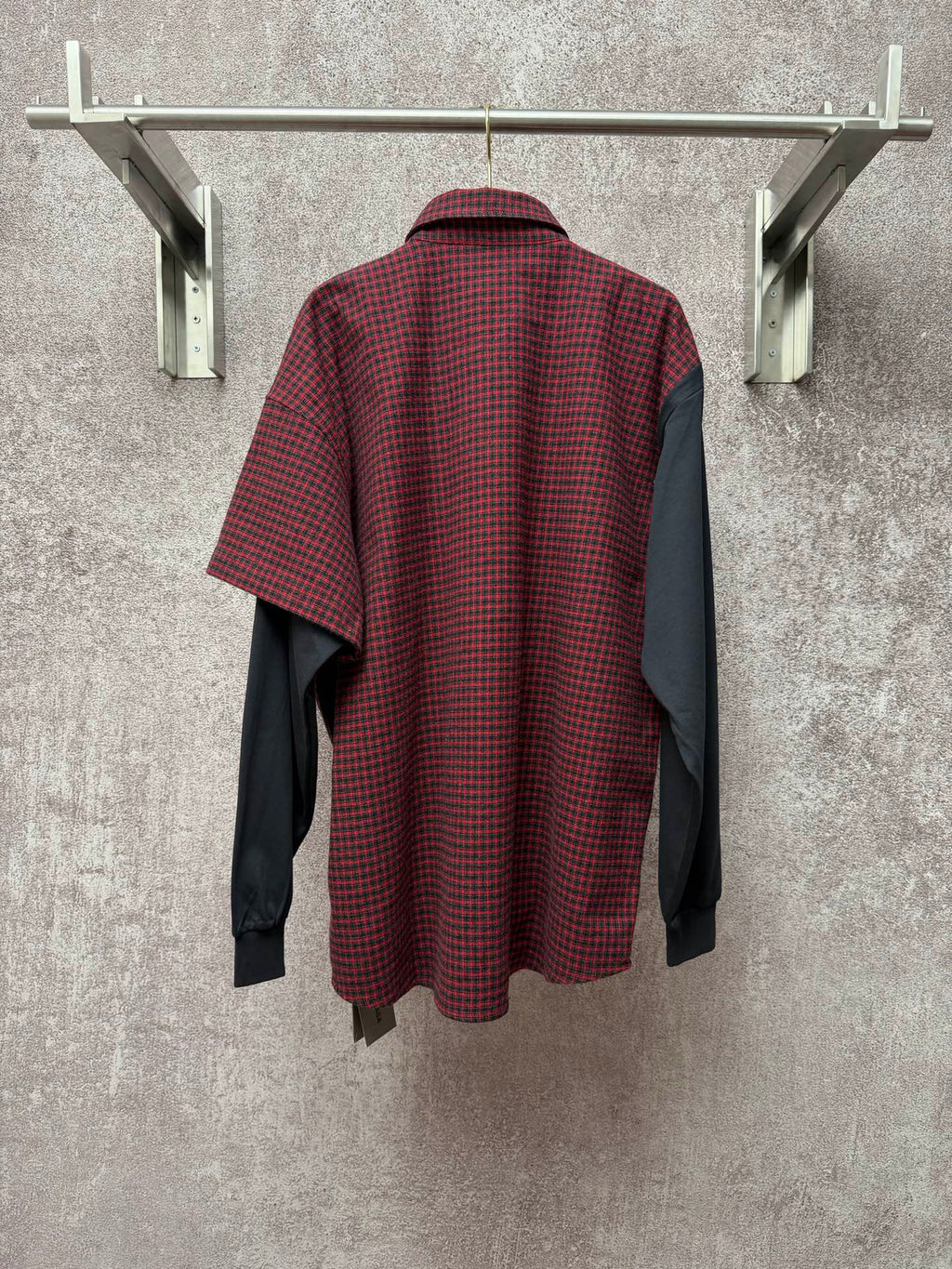 Long shirt back view with red-and-black check fabric and dark gray side panels