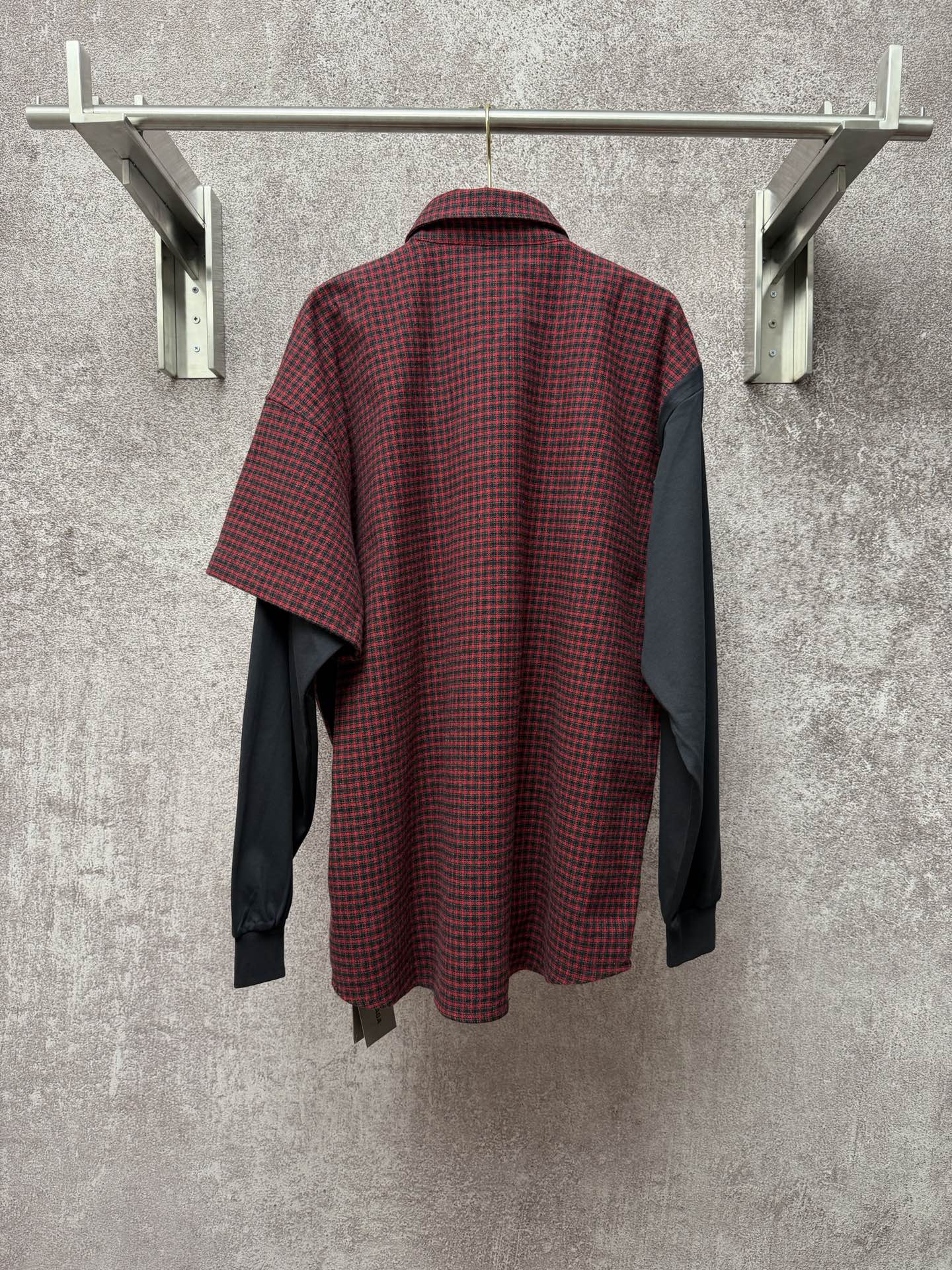 Long shirt back view with red-and-black check fabric and dark gray side panels