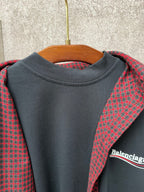 Dark gray crewneck long top with red plaid hooded layer, Balenciaga logo detail
