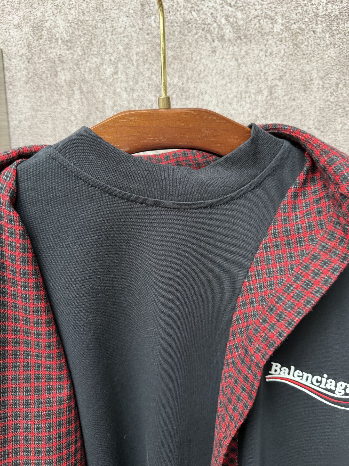 Dark gray crewneck long top with red plaid hooded layer, Balenciaga logo detail