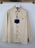 Beige long-sleeve button-up shirt with point collar and chest pocket