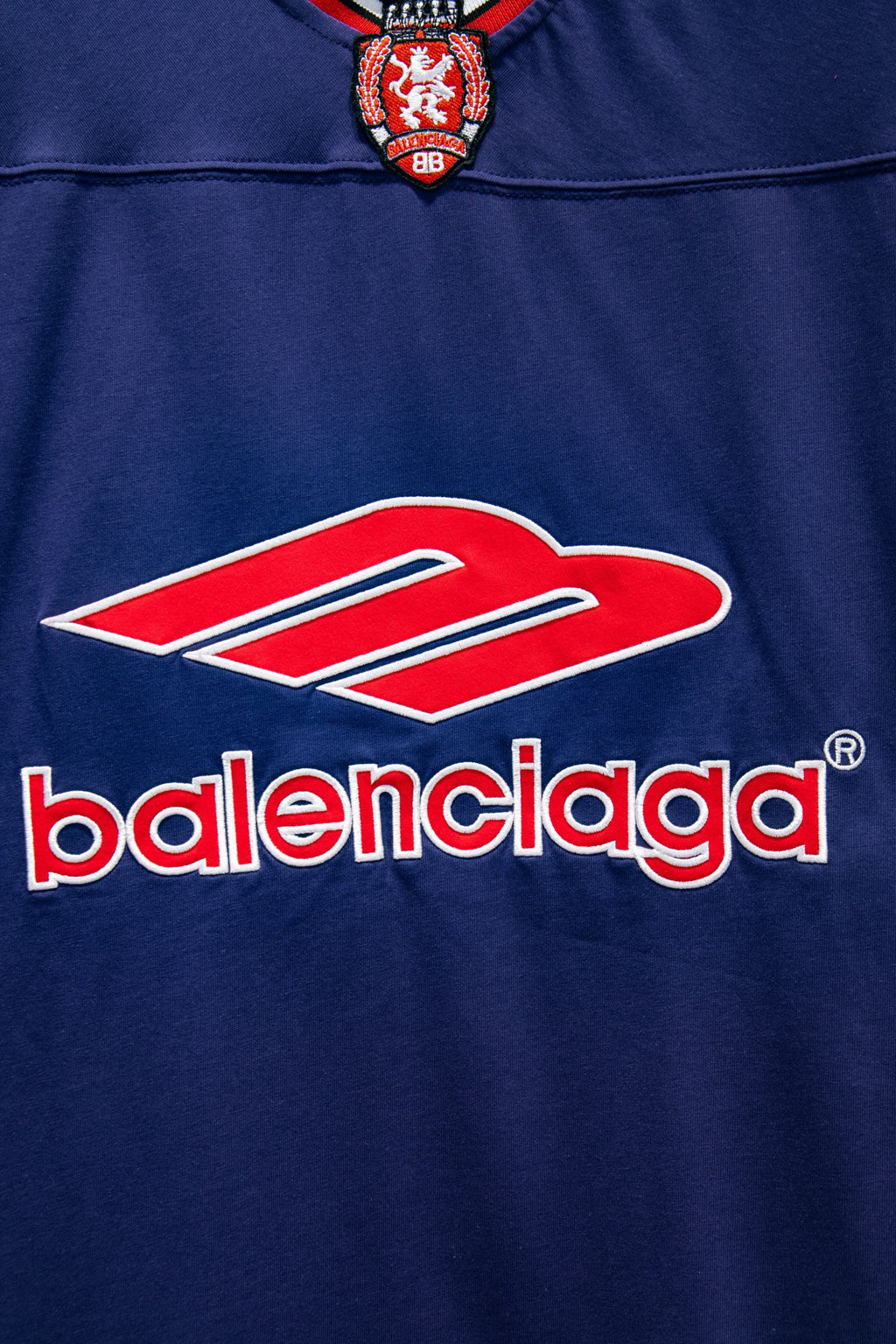 Balenciaga blue short-sleeve shirt with oversized Balenciaga logo and red swoosh